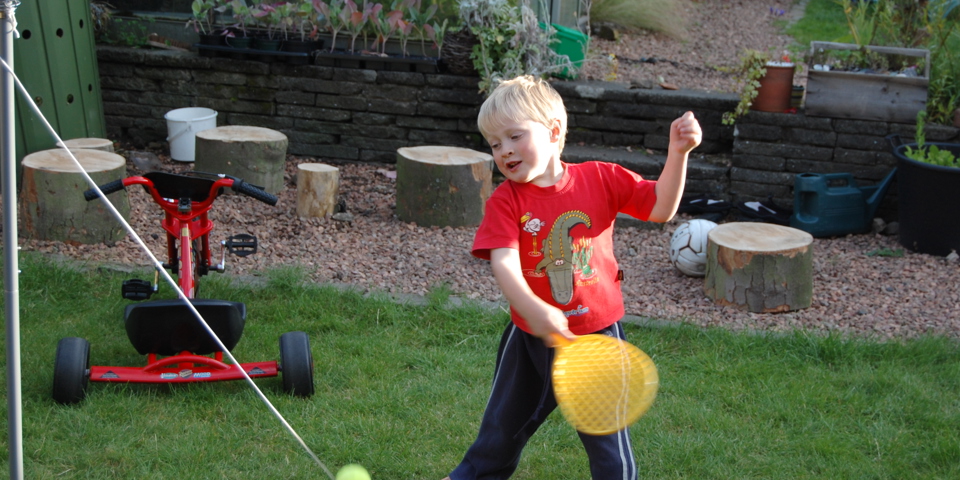 Child playing swing ball