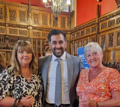 Staff with First Minister at reception