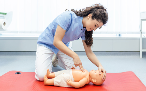 Nurse practicing on dummy