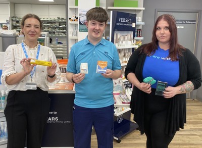 Group of staff holding naloxone kits