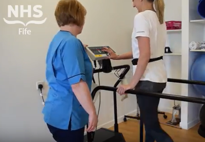 woman walking on treadmill