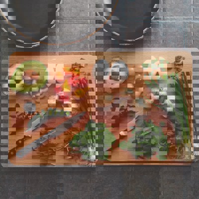 chopping board with vegetables on it