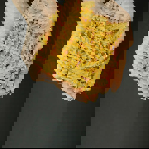 Hands full of Pasta