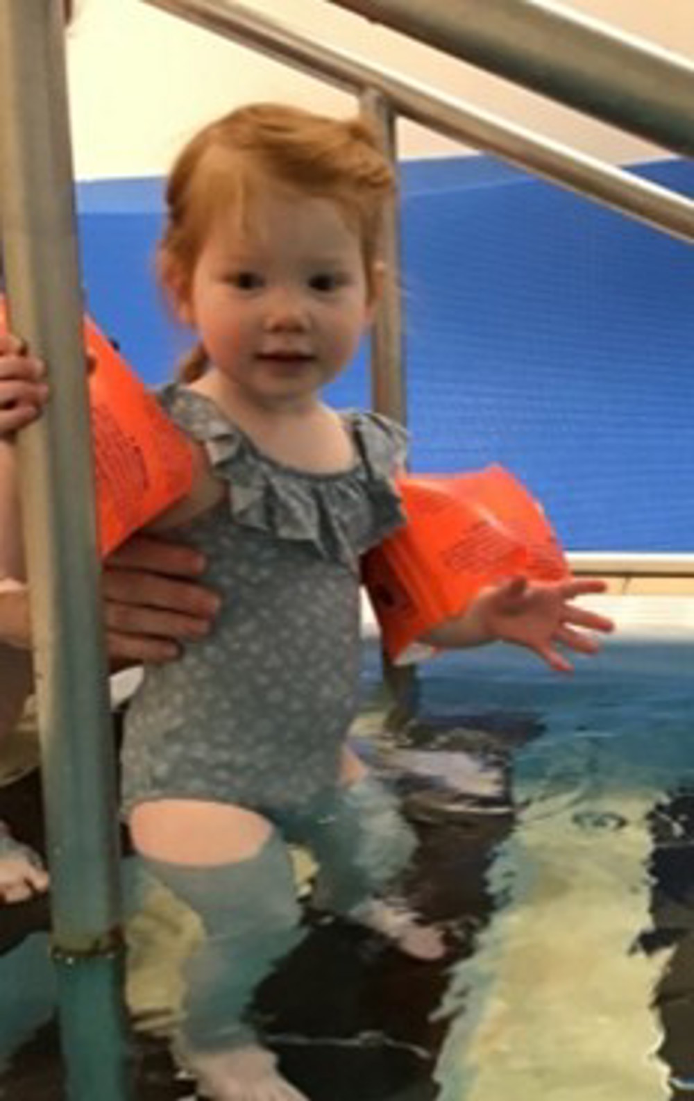 Child Standing In Pool