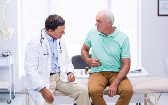 doctor sitting and examining patient