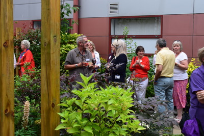 People gathering at Queen Margaret Hospital garden